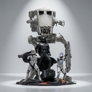 May include: A detailed Star Wars collectible statue featuring a grey AT-ST walker standing behind Darth Vader, a white clone trooper, and a blue and white clone trooper. The figures are positioned on a dark, rocky base with orange lava accents.