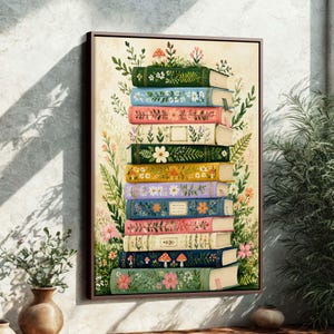 May include: A framed print featuring a stack of colorful books adorned with floral and botanical illustrations. The books are in shades of green, blue, pink, and yellow, with detailed drawings of flowers, leaves, and mushrooms. The artwork has a vintage, whimsical style.
