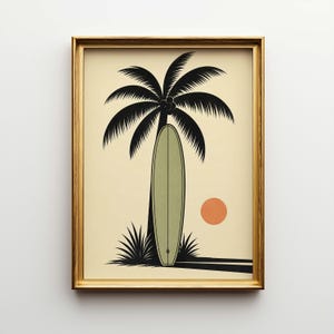 May include: Framed art print featuring a black silhouette of a palm tree and a surfboard leaning against it. A muted orange sun is in the background. The artwork is in a gold frame, evoking a tropical, beach theme.
