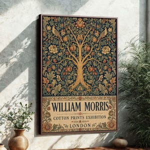 May include: A framed William Morris cotton prints exhibition art print. The artwork features a tree design with birds, flowers, and fruit in shades of gold, blue, and orange. The text "WILLIAM MORRIS" is displayed prominently.