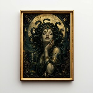 May include: A framed art print of Medusa. The image shows a woman with snakes for hair, wearing a jeweled crown, set against a full moon and dark foliage. The frame is gold. The artwork is a portrait.
