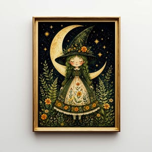 May include: A framed art print featuring a whimsical illustration of a young witch. She wears a green dress and hat adorned with flowers, standing before a crescent moon and starry night sky. The artwork has a gold frame.