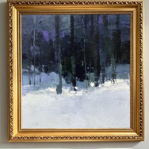 May include: A square oil painting in a decorative gold frame depicting a winter forest scene at twilight. The artwork features dark, vertical tree trunks set against a snowy ground rendered in shades of white, light blue, and deep navy purple.