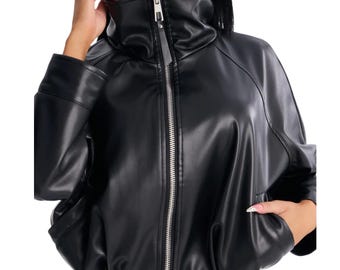 May include: A black faux leather jacket featuring a high funnel neck collar, a full-length silver-toned metal zipper closure, long sleeves with structured cuffs, and a cinched hemline with adjustable drawstrings, providing a relaxed fit.
