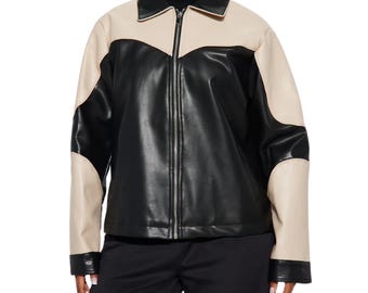 May include: A color-blocked jacket featuring a black central panel and sleeves with beige accents on the shoulders and outer arms. The jacket has a pointed collar, a full-length silver-toned front zipper, and black cuffs at the wrists.