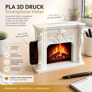 May include: A white 3D printed PLA smartphone holder shaped like a fireplace mantel with ornate floral carvings. The center displays a graphic of a burning fire with logs. Text on the image includes PLA 3D DRUCK, Smartphone Halter, and other German phrases.