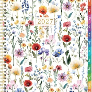 May include: A 2027 spiral-bound planner featuring a white cover with a colorful watercolor floral pattern. The design includes various wildflowers in shades of red, yellow, blue, and purple. A gold-bordered box displays the year 2027 in the center.