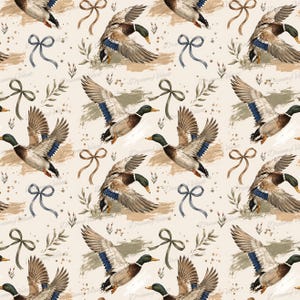 May include: A repeating pattern on a cream background featuring mallard ducks in flight with brown, green, and blue plumage. The design includes illustrations of thin ribbons tied in bows and small leafy sprigs, with the text DreamyVelvet visible.