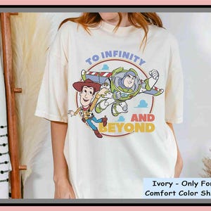 Woody Buzz Lightyear To Infinity And Beyond Comfort Colors T-shirt, Toy Story Friends Disney Shirt – Unisex T-Shirt, Hoodie, Kids Tee & Baby Romper | All Colors | Premium DTF Print