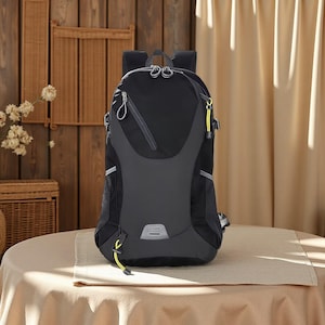 May include: A black backpack featuring a textured upper panel, a smooth central section, and a small reflective silver accent at the base. The bag includes multiple zippered compartments with silver pulls and bright yellow corded zipper pulls.