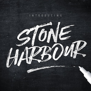 May include: A black chalkboard background featuring the white text INTRODUCING STONE HARBOUR written in a distressed, hand-lettered brush script style. A white paint marker with a black cap is positioned in the bottom right corner of the image.