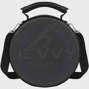May include: A black circular carrying case with a top handle and an adjustable shoulder strap attached by silver metal clips. The front surface features a faint silhouette of a person running and the text JEVVY CRAFTS printed in a dark gray font.