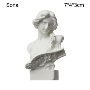 May include: A white bust sculpture of a woman with flowing hair, holding a lyre. The sculpture is 7 cm x 4 cm x 3 cm. The word "Sona" is printed above the sculpture.
