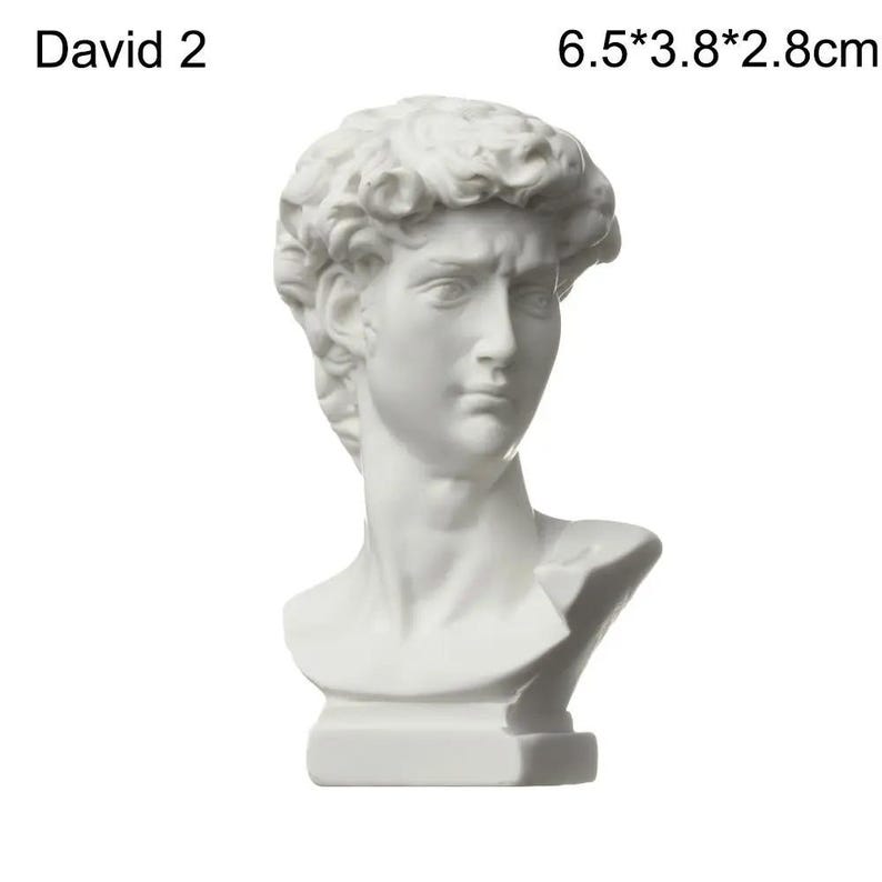 May include: A white bust of David, a classical sculpture. The bust is 6.5cm tall, 3.8cm wide, and 2.8cm deep. The sculpture features detailed facial features and curly hair. The text "David 2" is above the bust.