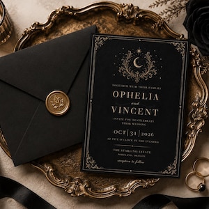 May include: A black wedding invitation with gold lettering and ornate border sits on a gold-toned tray next to a matching envelope sealed with a gold wax stamp. The invitation reads "Ophelia and Vincent" and the wedding date.