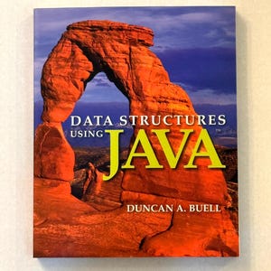 May include: A book titled "Data Structures Using Java" by Duncan A. Buell. The cover features a photograph of a red rock arch under a blue sky. The word "JAVA" is in large, yellow letters.