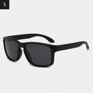 May include: Black sunglasses with a rectangular frame and dark lenses. The sunglasses have a matte finish and a classic, timeless design. The arms curve slightly for a comfortable fit. A stylish accessory for sun protection.