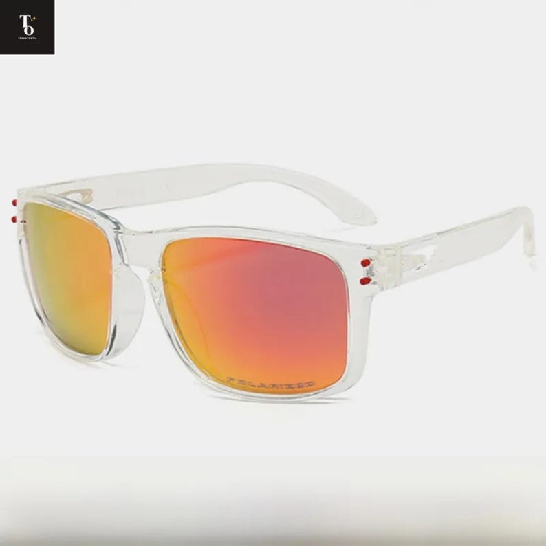 May include: Clear-framed sunglasses with polarized orange-red lenses. The sunglasses have a square shape and a transparent frame. The word "POLARIZED" is printed on the bottom of the right lens.