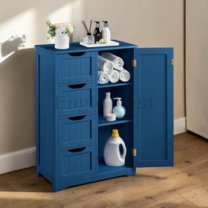 May include: A blue wooden bathroom cabinet with four drawers and an open door revealing shelves with rolled towels, bottles, and a detergent container. A vase of flowers and decorative items sit on top.