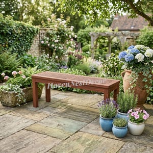 May include: A rectangular wooden bench with a slatted seat and four straight legs. The bench features a dark brown finish and is positioned on a stone patio. The text Haven Nest Decor is visible across the center of the bench seat.