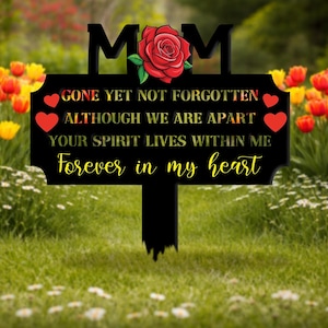 May include: Black metal garden stake with the word "MOM" at the top, a red rose, and the inscription "GONE YET NOT FORGOTTEN, ALTHOUGH WE ARE APART, YOUR SPIRIT LIVES WITHIN ME, Forever in my heart." Red hearts are also included.