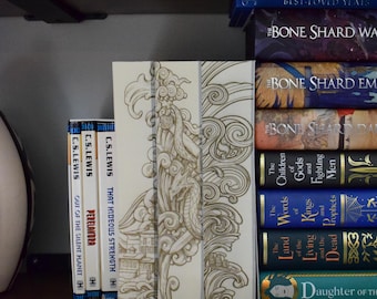 The Drowning Empire Trilogy paperbacks with unique laser engraved page edges.