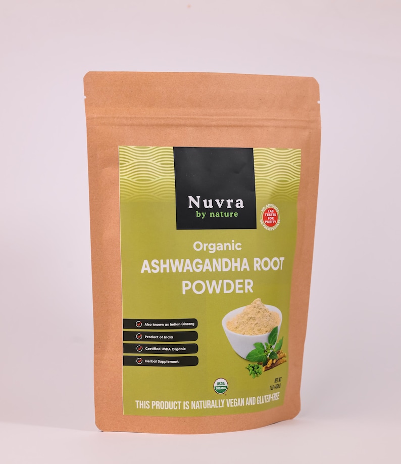 May include: A brown paper bag of organic Ashwagandha root powder. The label features the brand name "Nuvra by nature" and details about the product, including "Also known as Indian Ginseng" and "Certified USDA Organic". The product is described as naturally vegan and gluten-free.