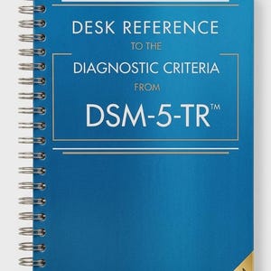 May include: A blue spiral-bound desk reference book with the text "DESK REFERENCE TO THE DIAGNOSTIC CRITERIA FROM DSM-5-TR™". The book has a gold "PREMIUM EDITION" sticker in the corner.