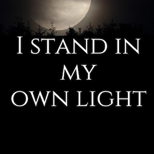 May include: A dark image featuring a full moon in a night sky above a silhouette of trees. The text "I STAND IN MY OWN LIGHT" is displayed in white, centered on the image.