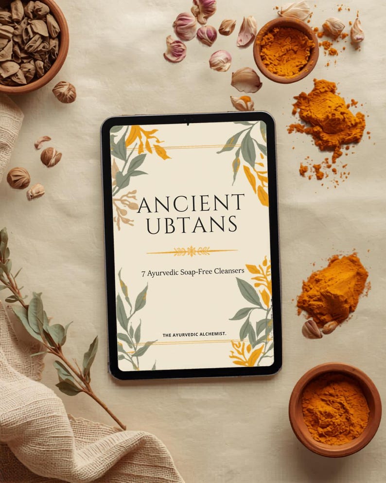 May include: A tablet displaying a digital cover titled ANCIENT UBTANS 7 Ayurvedic Soap-Free Cleansers THE AYURVEDIC ALCHEMIST, decorated with yellow and green leaf illustrations, surrounded by small bowls of turmeric powder and scattered dried herbs.