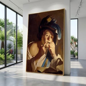May include: A framed oil painting of a man playing a flute. The man is wearing a hat with feathers and a white shirt with a blue and yellow sash. The painting has a gold frame and is displayed in a modern room with large windows.