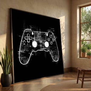 Op de afbeelding: Een groot rechthoekig wandkunstwerk met een contrastrijke witte lijntekening van een videogamecontroller tegen een effen zwarte achtergrond. Het ontwerp van de controller bevat ingewikkelde digitale glitch- en printplaatpatronen.