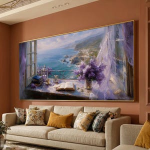May include: A large framed painting depicts a coastal scene with a window overlooking the ocean. The painting features a vibrant display of purple flowers, an open book, and a silver tea set. The artwork is set against a backdrop of a blue sea and sky.