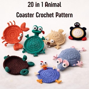 May include: A white ceramic mug with a black handle and the text "But First, Coffee" in a handwritten style. The mug is on a white surface. The mug is approximately 10 cm tall.