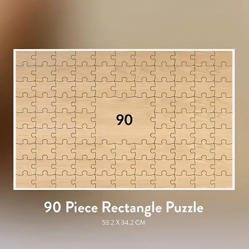 May include: A rectangular wooden puzzle with 90 pieces. The center of the puzzle features the number "90". The puzzle measures 53.2 x 34.2 cm (20.9 x 13.5 inches) and has the text "90 Piece Rectangle Puzzle" at the bottom.