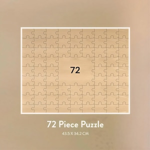 May include: A 72-piece puzzle with a light wood grain finish. The puzzle is rectangular, with a white border. The number 72 is centered on a lighter wood-toned square. The text "72 Piece Puzzle" and dimensions 43.5 x 34.2 CM are below the puzzle.