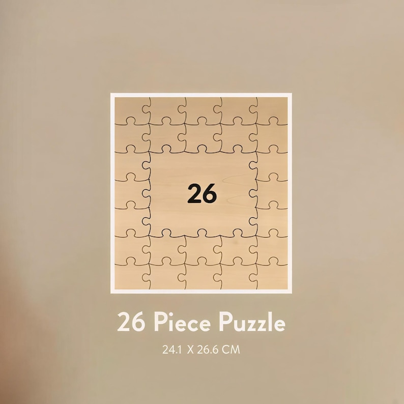 May include: A 26-piece wooden puzzle with a light brown finish. The puzzle is square, with a white border and the number 26 in the center. The text "26 Piece Puzzle" and dimensions 24.1 x 26.6 CM are below the puzzle.