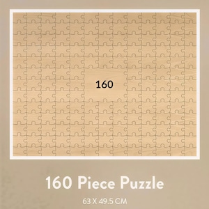 May include: A 160-piece puzzle with a light brown wooden texture. The puzzle is rectangular with a white border. The number "160" is printed in black on a light brown square in the center. The text "160 Piece Puzzle" and dimensions are at the bottom.
