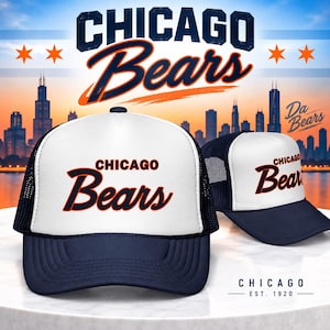 May include: A navy blue and white trucker hat featuring the text Chicago Bears in navy blue and orange lettering on the front panel. The hat has a mesh back and a solid navy blue brim. The design is displayed against a Chicago city skyline background.