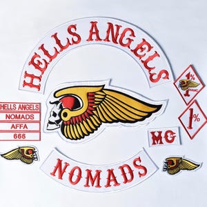 May include: A collection of embroidered patches featuring the text HELLS ANGELS in a white arch, a central winged skull emblem, a NOMADS arch, and smaller patches with the text NOMADS, AFFA, 666, MC, and 1% symbols in red, white, and yellow.