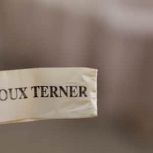 May include: A white tag with the text "Bijoux Turner" printed in black.