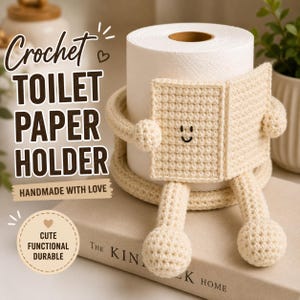 May include: A cream-coloured crochet toilet paper holder featuring a character with arms holding a small book, legs with round feet, and a smiling face. The text reads Crochet TOILET PAPER HOLDER, HANDMADE WITH LOVE, and CUTE FUNCTIONAL DURABLE.