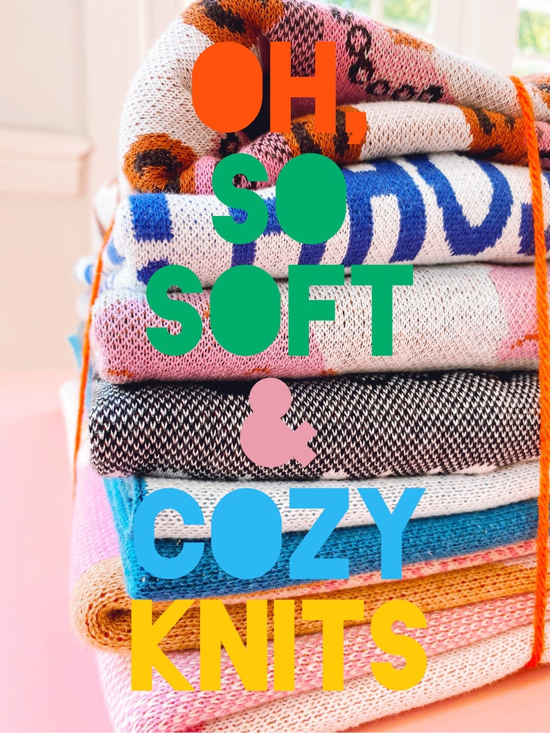 May include: A stack of colorful knit blankets with the text "OH SO SOFT & COZY KNITS" in large, colorful letters.