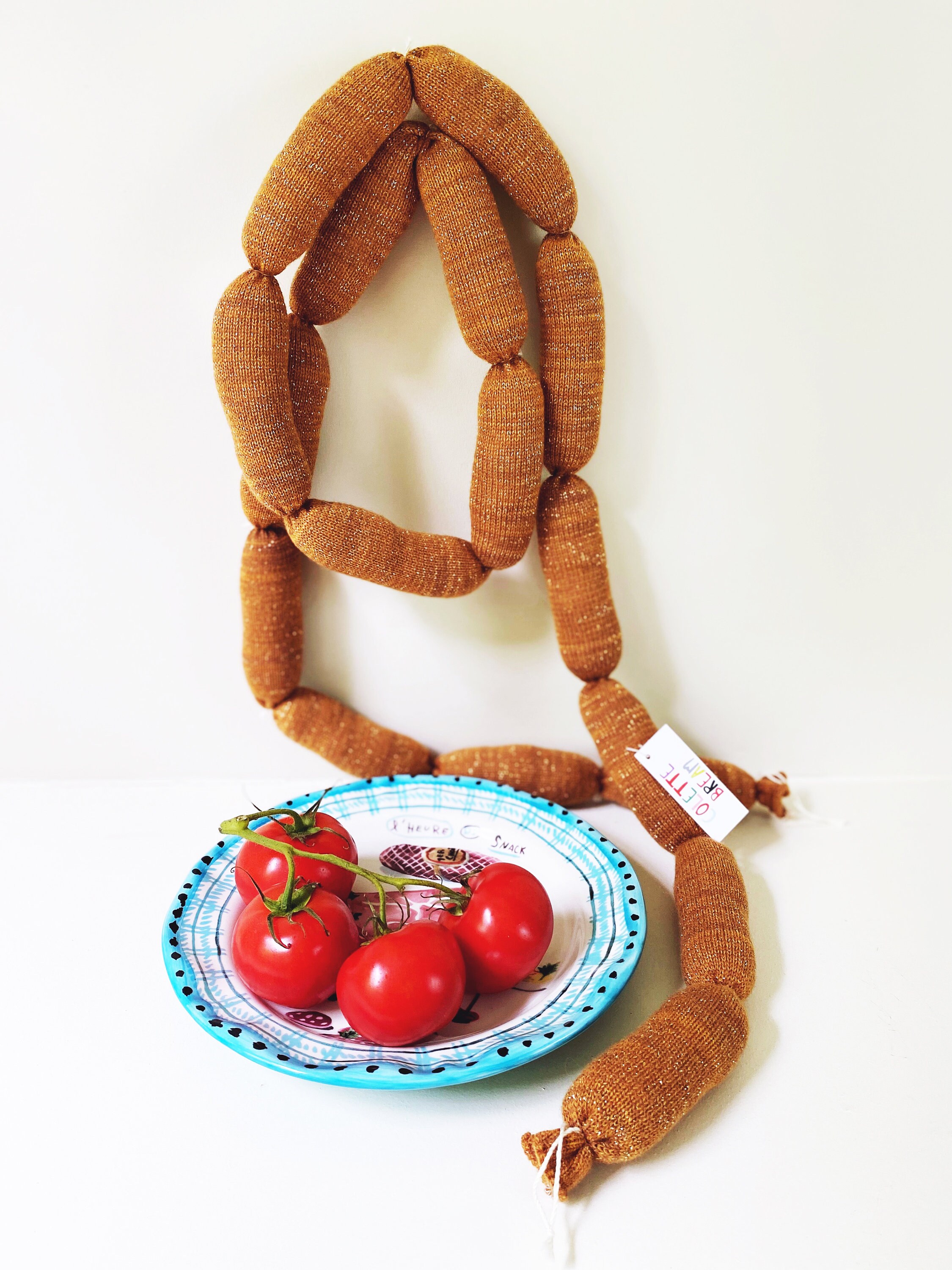 Sausage link dog toy top