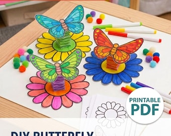 May include: A DIY butterfly craft project featuring three paper butterflies in blue, green, and orange, each mounted on a paper flower base with accordion-folded stems. The set includes colorful markers, small pom-poms, and printable PDF sheets.