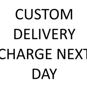 May include: A white background featuring the black text CUSTOM DELIVERY CHARGE NEXT DAY arranged in four lines. The font is a simple, sans-serif typeface with clear, bold, and legible capital letters centred against the plain white backdrop.