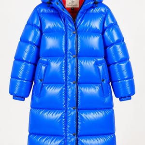 May include: A long, glossy blue puffer coat featuring a hood, a vibrant red interior lining, and a front closure with black snap buttons. The coat has horizontal quilted channels, long sleeves with elastic cuffs, and two side pockets.