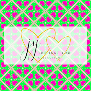 May include: A vibrant pattern featuring pink hearts on a green grid background. The design includes a white rectangle with the text "jy" and "THE JUST YOU COLLECTION" in black and gold. Two gold heart outlines are also present.