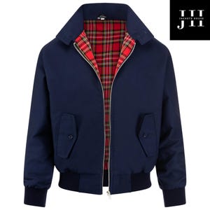 May include: A navy blue jacket with a red and black tartan lining. The jacket features a zip-up front, two front pockets, and a ribbed hem and cuffs. The collar is a classic style. The logo "JACKETS HOUSE J11" is in the upper right corner.