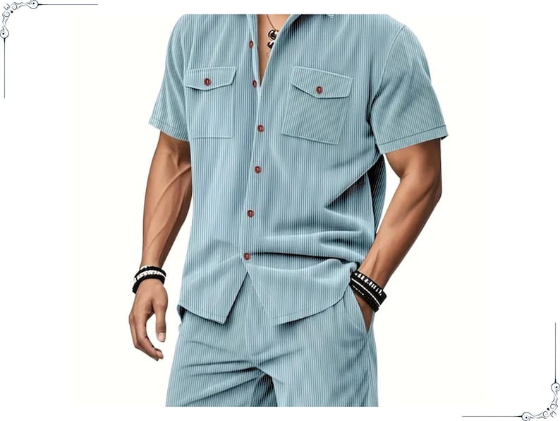 May include: A light blue, short-sleeved shirt and matching shorts set. The shirt has two chest pockets and brown buttons. The fabric has a vertical ribbed texture. The model is wearing black and white bracelets.